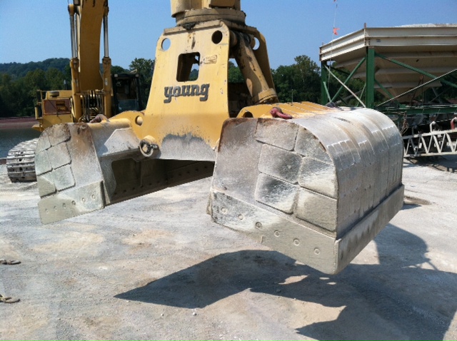Armor clamshell buckets with Kenco Wear Patch